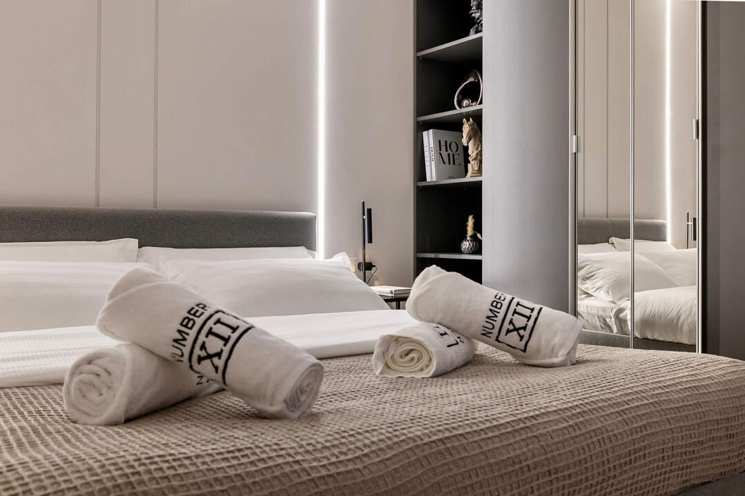 Rest in the spacious master bedroom with a plush king-size bed and premium linens.